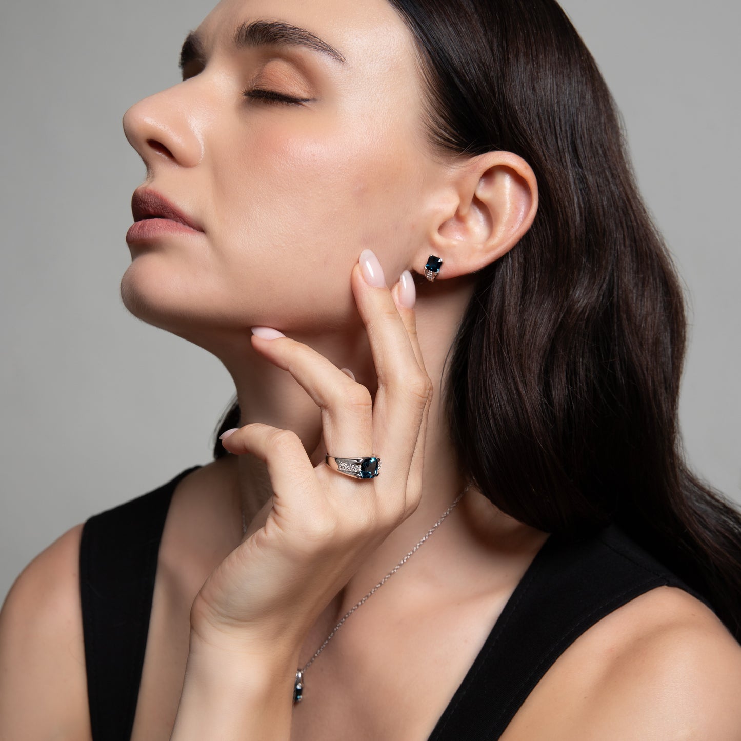 Le Petite Folie: Iolite Emerald Cut 4-Prong Ear Huggie Studs with White Topaz Accents in Rhodium Plated 925 Silver