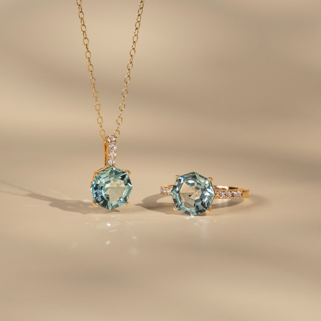 Novalty: Light Blue Topaz Hexagon Cut 4-Prong Pendant with White Topaz in 18K Yellow Gold