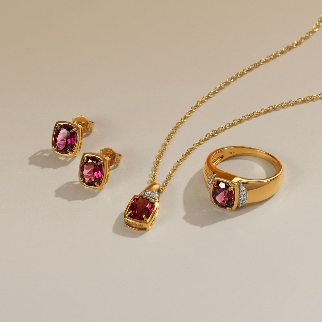 Le Petite Folie: Rhodolite Garnet Oval Cut 4-Prong Stud Earrings in Gold Plated 925 Sterling Silver