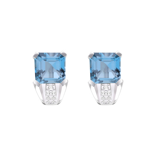Le Petite Folie: London Blue Topaz Emerald Cut 4-Prong Ear Huggie Studs with White Topaz Accents in Rhodium Plated 925 Silver