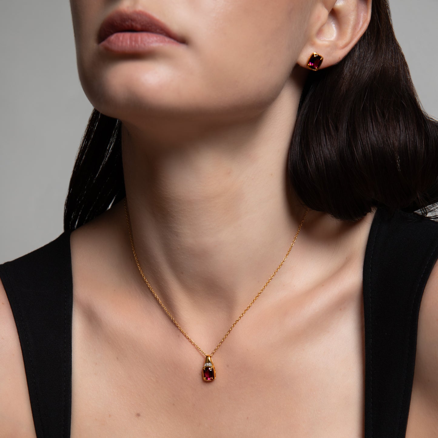 Le Petite Folie: Rhodolite Garnet Oval Cut 4-Prong Stud Earrings in Gold Plated 925 Sterling Silver