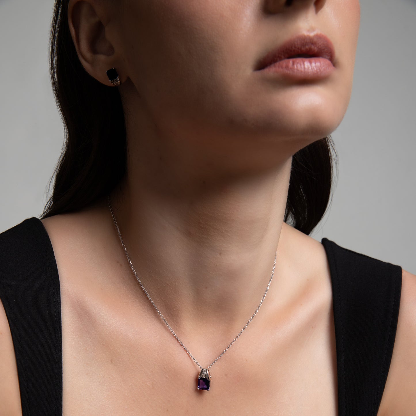Le Petite Folie: London Blue Topaz Emerald Cut 4-Prong Pendant Necklace with White Topaz Accents in Rhodium Plated 925 Silver