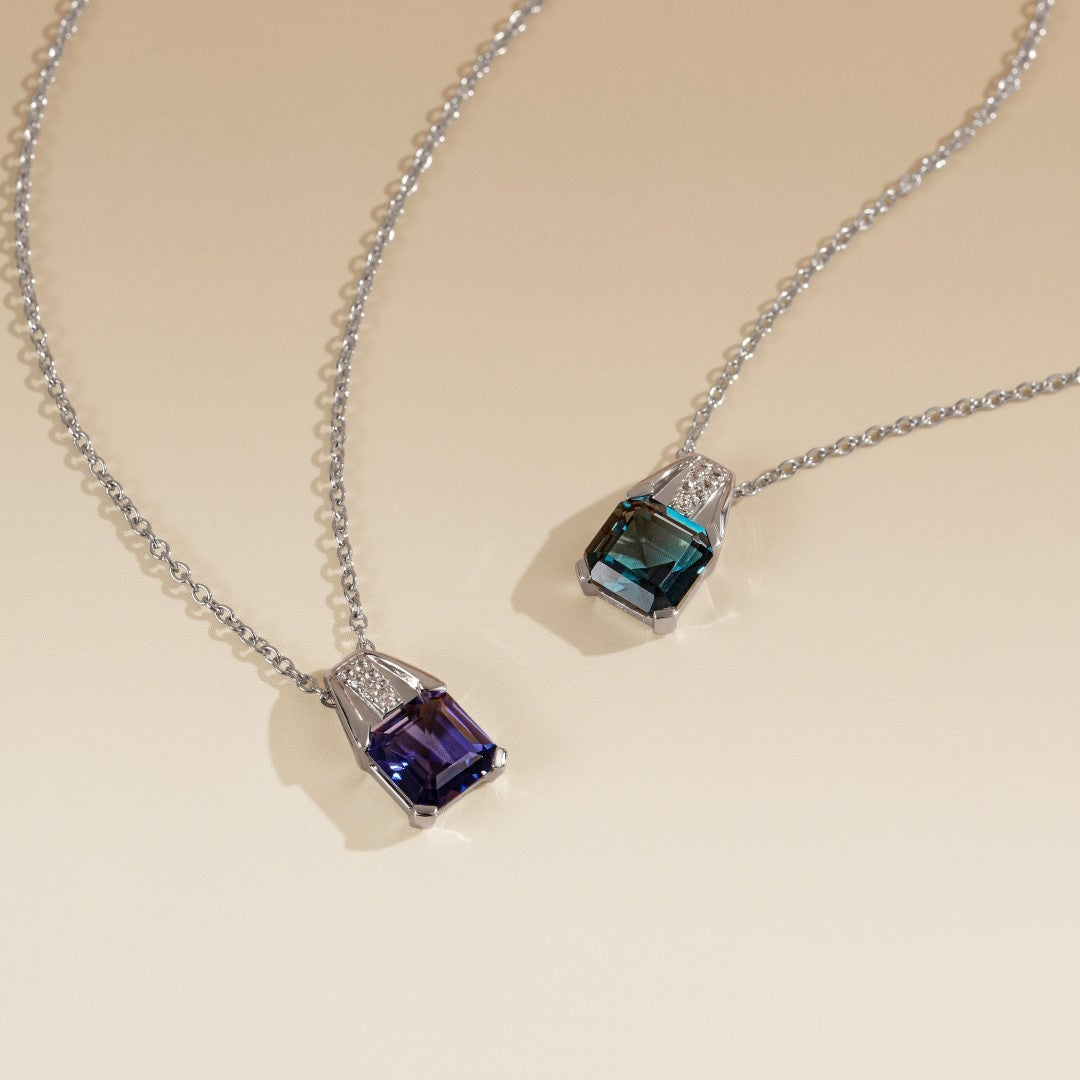Le Petite Folie: Iolite Emerald Cut 4-Prong Pendant Necklace with White Topaz Accents in Rhodium Plated 925 Silver