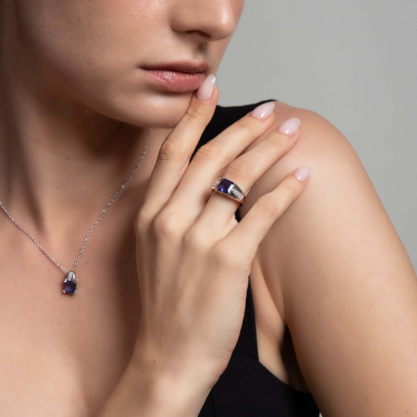 Le Petite Folie: Iolite Emerald Cut 4-Prong Band Ring with White Topaz Accents in Rhodium Plated 925 Silver