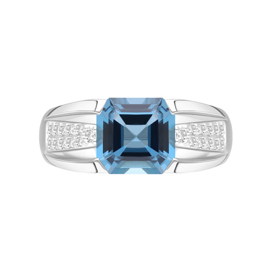 Le Petite Folie: London Blue Topaz Emerald Cut 4-Prong Band Ring with White Topaz Accents in Rhodium Plated 925 Silver